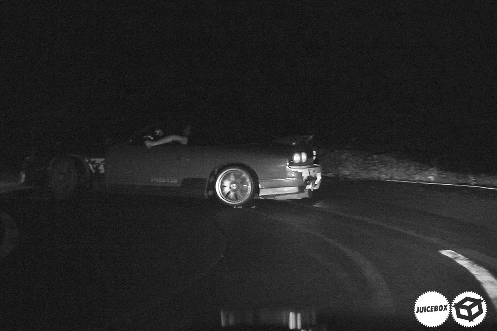 A jdm car drifting at night in the mountain